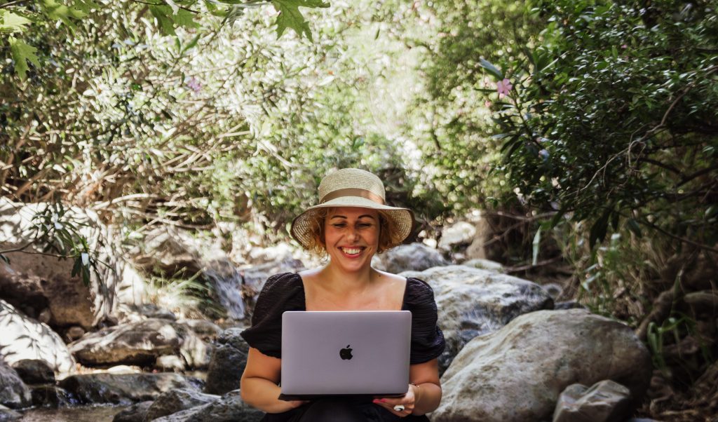 Beautiful image in the river lady with a laptop