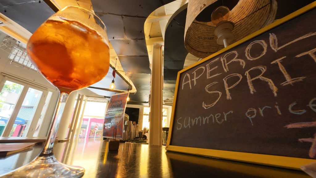 Aperol Breeze in Athens in a social cafe and gift shop
